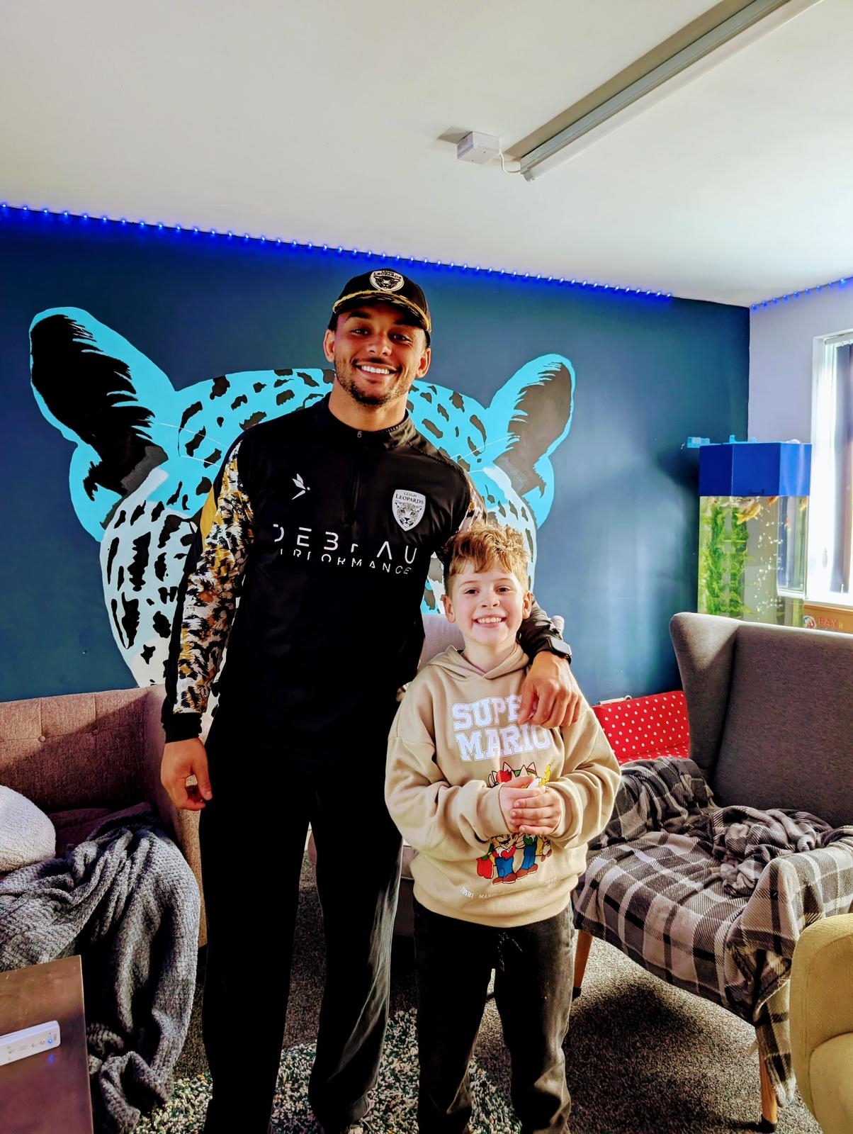 Leigh Leopards player, Umyla Hanley with children from the Leigh Leopards Player Development Pathway